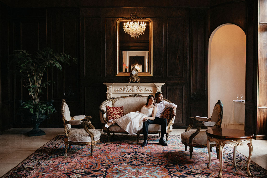 A newly engaged couple is photographed at Chateau Nouvelle, a chateau wedding venue Houston TX couples choose for French aesthetic