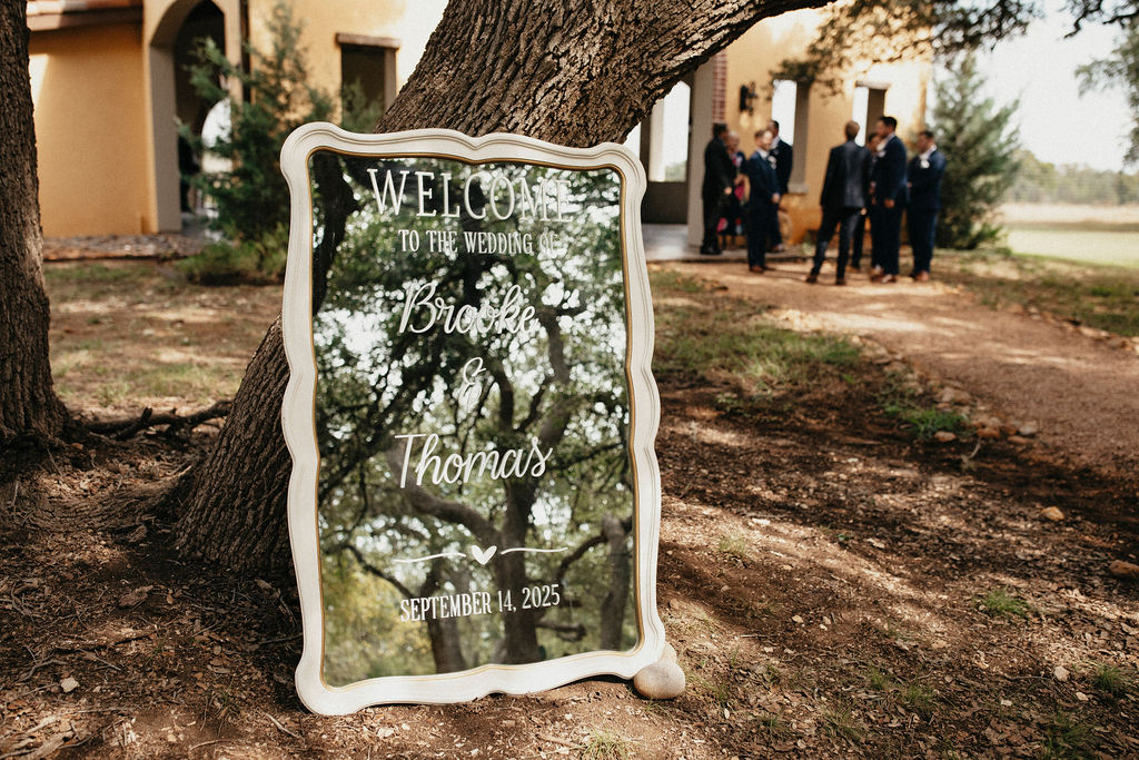 A mirror displaying the couple's name and wedding date is photographed outside their trattoria lisina wedding
