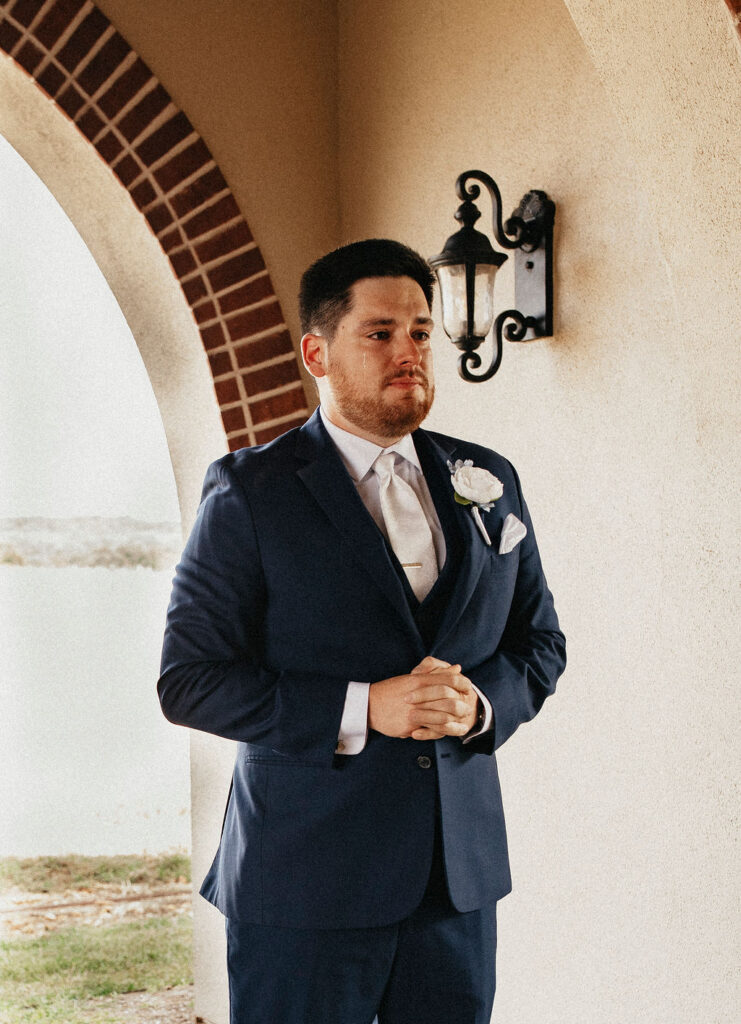 A groom has an emotional reaction to seeing his bride for the first time at their texas hill country elopement