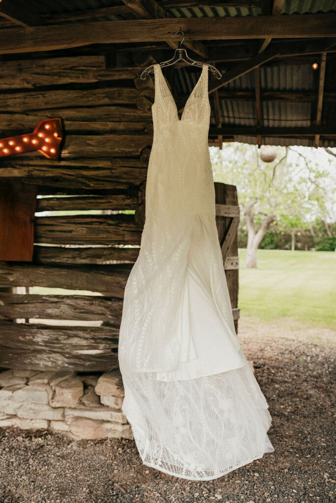 A wedding dress is photographed at a wedding held at pecan springs ranch austin texas