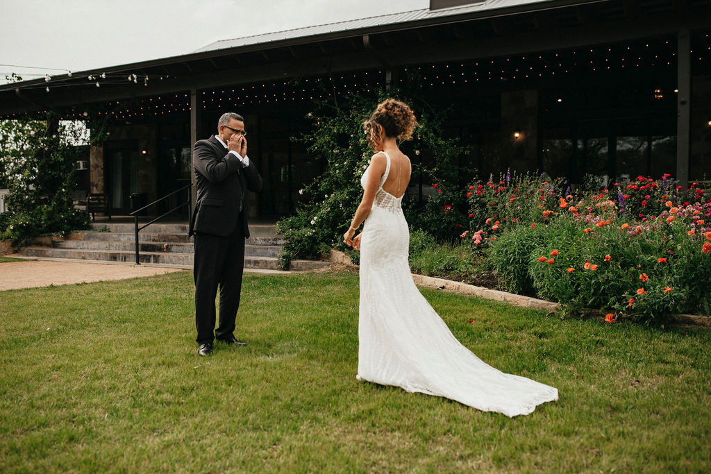 A first look between a bride & her father is photographed at her Austin Texas wedding