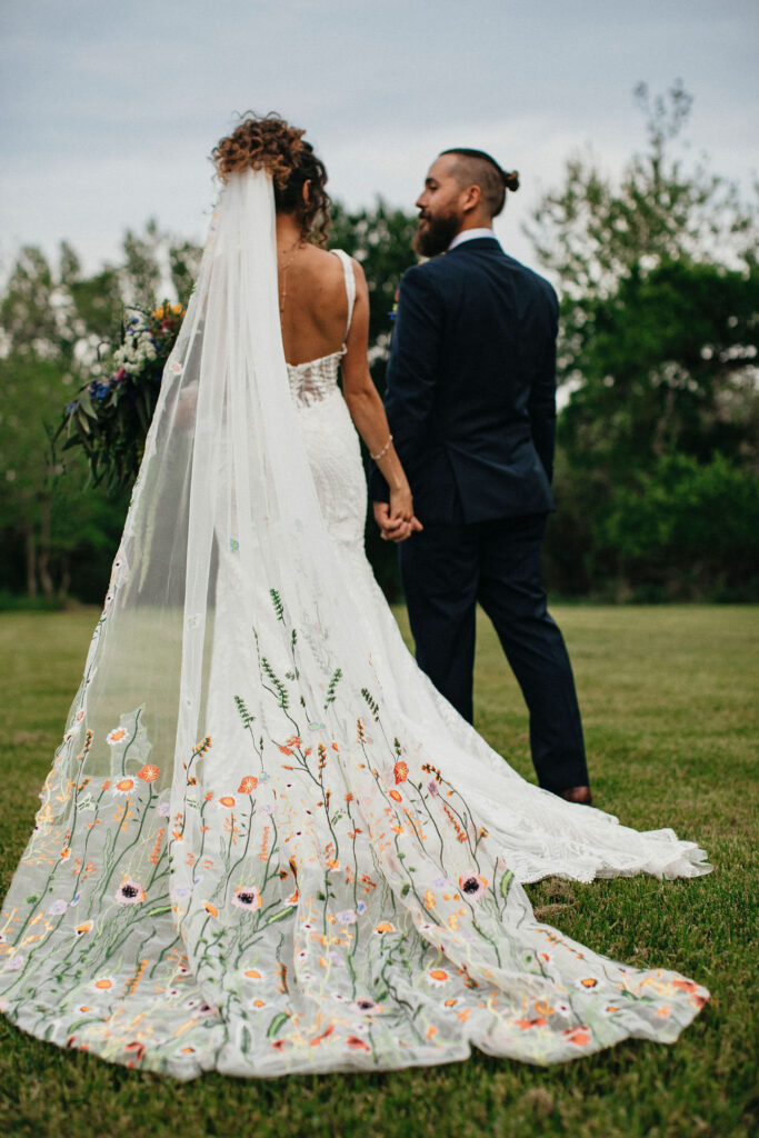 Embroidered florals are photographed on a bride's veil at an Austin Texas wedding at Pecan Springs Ranch