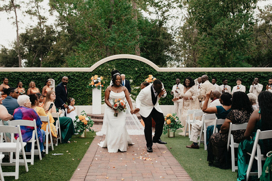 Newlyweds celebrate following their wedding ceremony at the springs in cypress