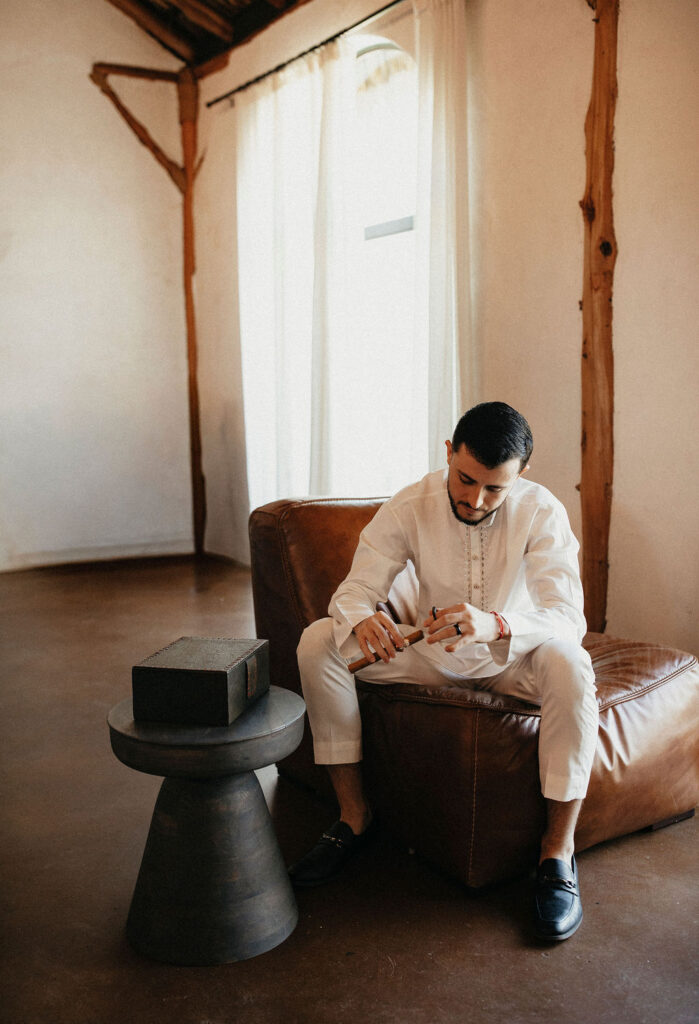 A groom prepares for his wedding at Three Bells Mission in Wallis, TX