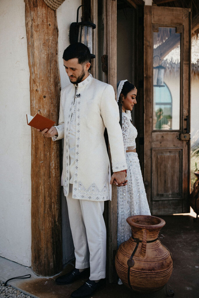 A bride & groom share a private moment before their Texas wedding at Three Bells Mission