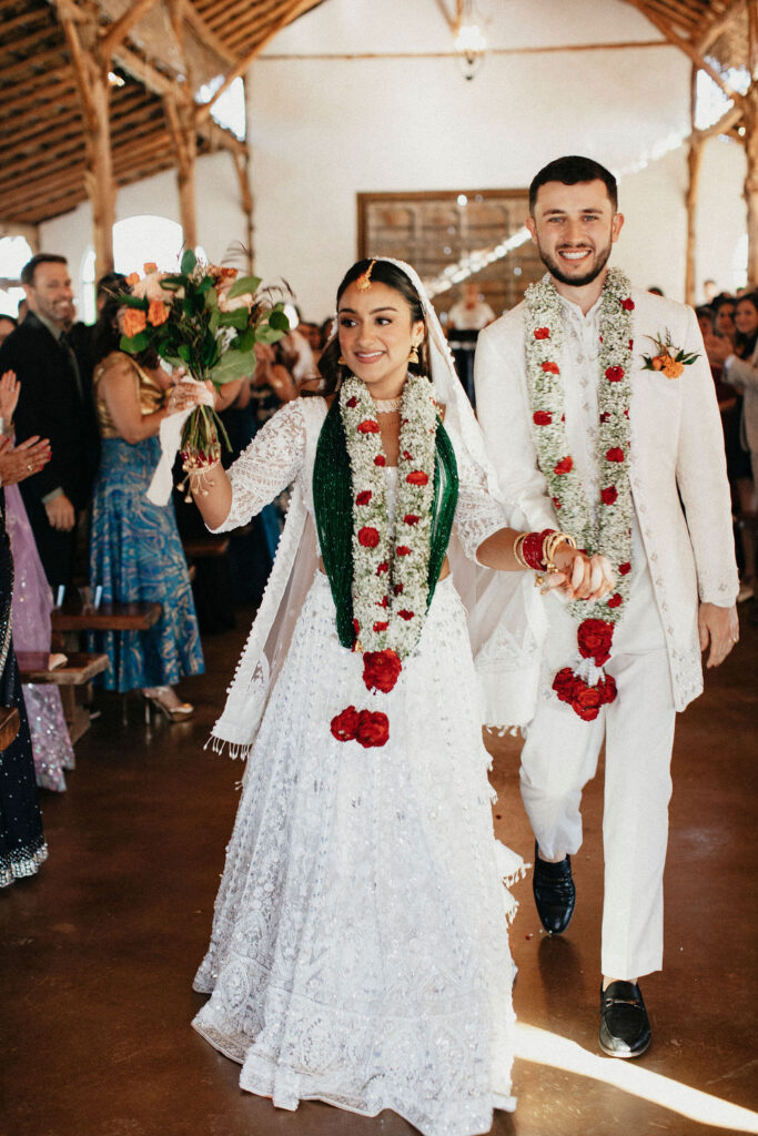 Newlyweds celebrate following their Hindu ceremony at their Texas wedding