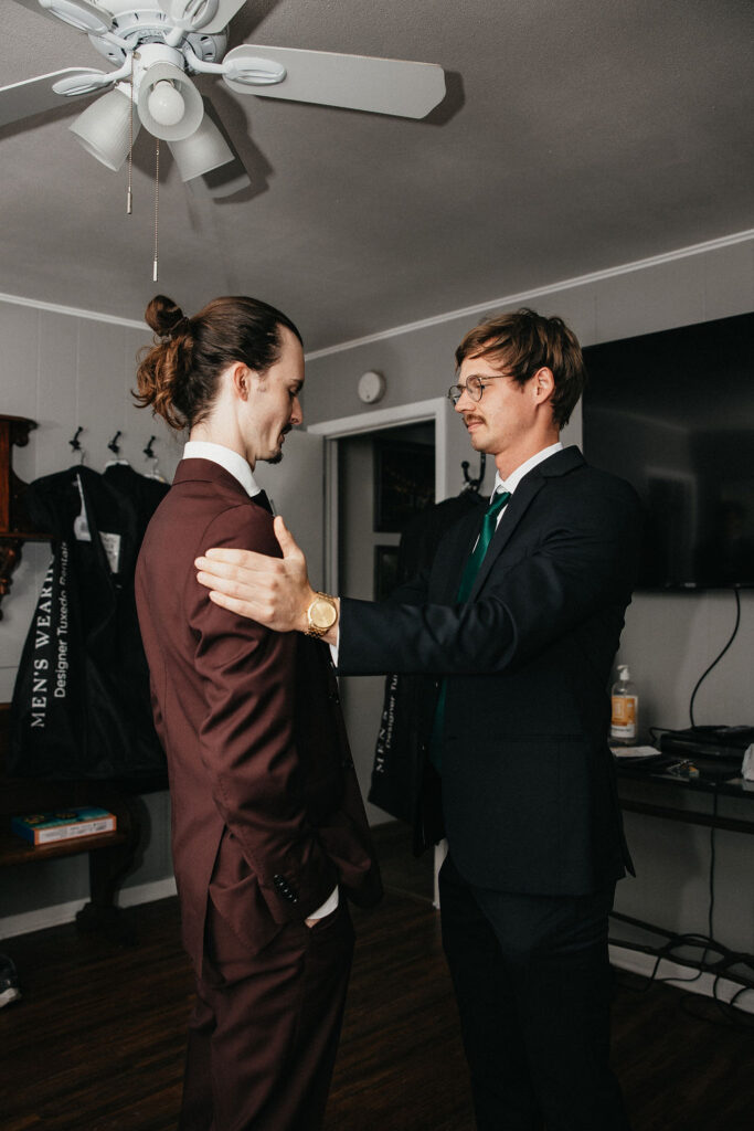 A groom gets dressed for his kindred oaks georgetown wedding 