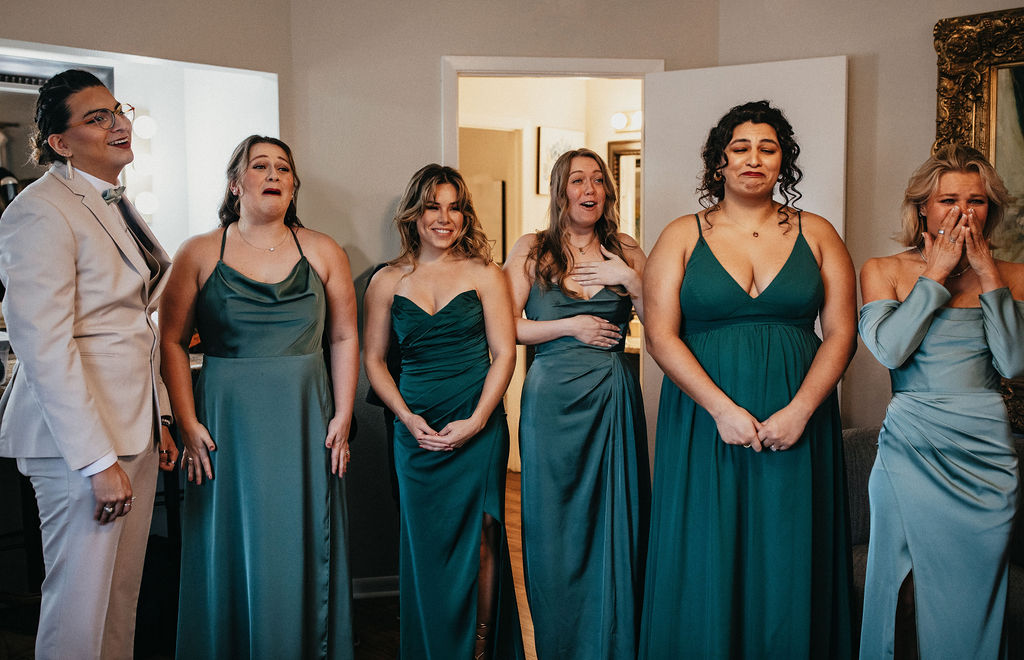 A bridal party have an emotional response to seeing the bride for the first time at her kindred oaks georgetown texas wedding 