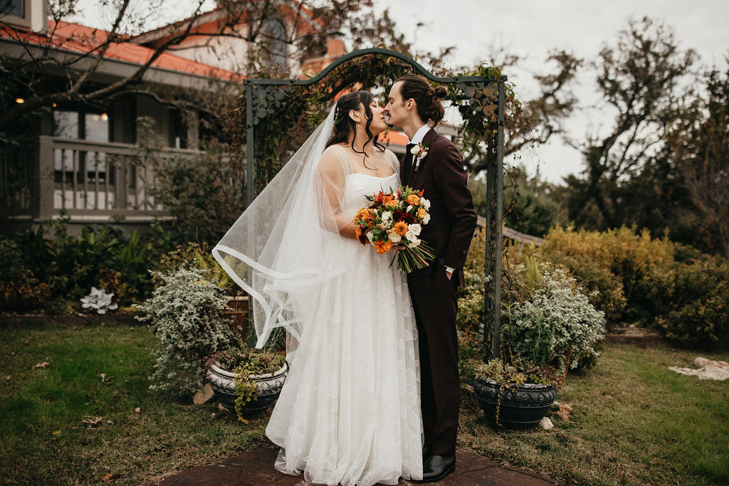 Newlyweds are photographed at a wedding venue in georgetown tx