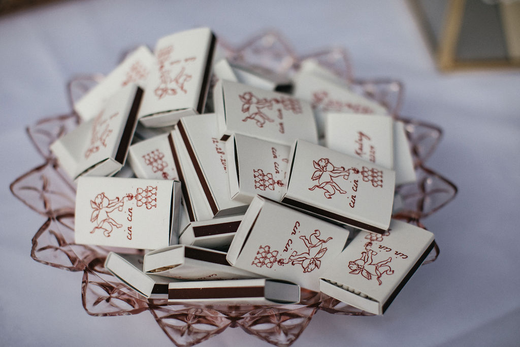 A bowl of personalized matchbooks are photographed at a wedding in Houston