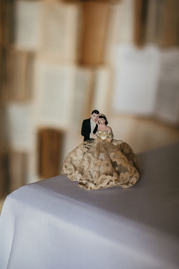A vintage inspired cake topper at a wedding in Houston