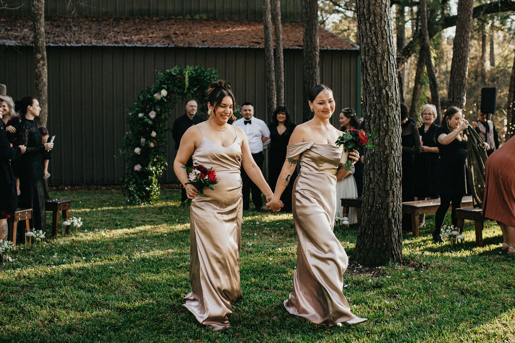 Bridesmaids in a champagne colored dresses are photographed at a winter wedding in Texas 