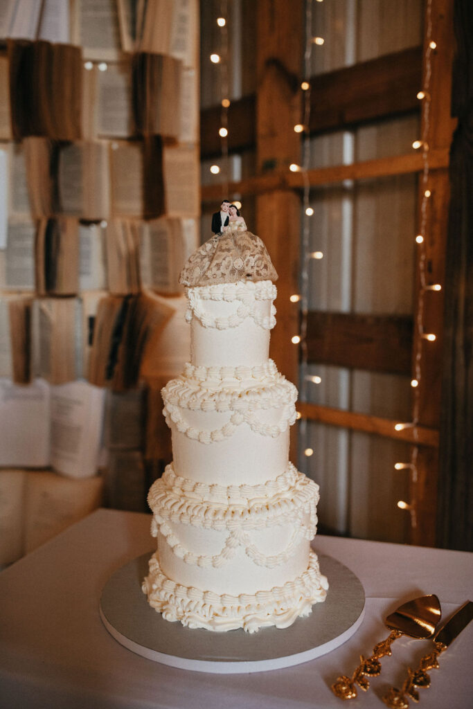 A vintage inspired three tiered wedding cake is photographed at a Houston TX wedding 