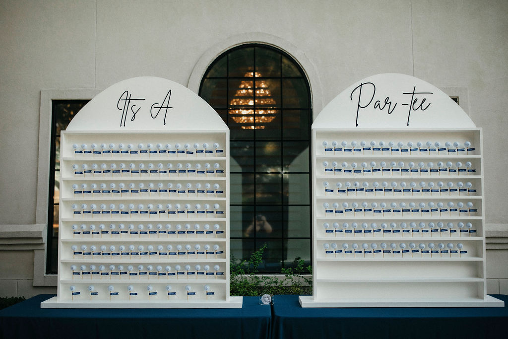 A golf themed seating arrangement is photographed at a wedding at the peach orchard venue in woodlands tx