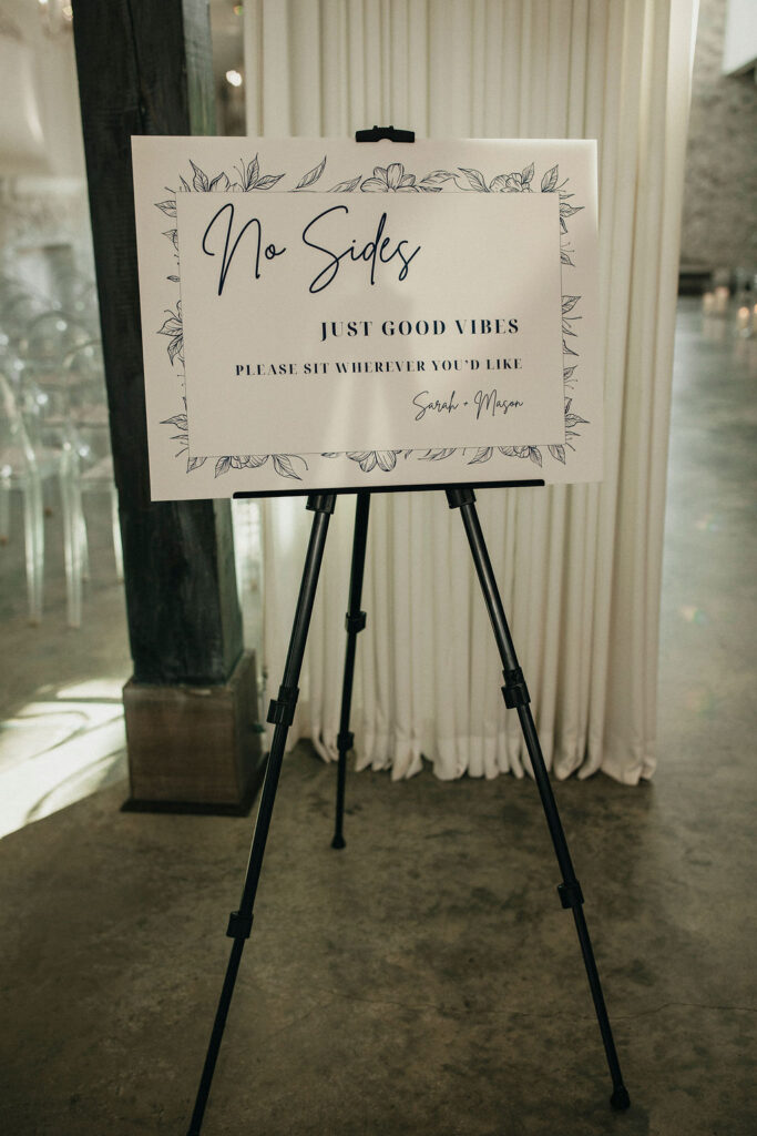 A sign welcomes guests to a wedding at the peach orchard venue