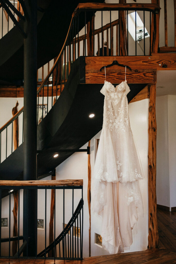 A wedding dress hangs in a photo taken at a wedding venue central texas