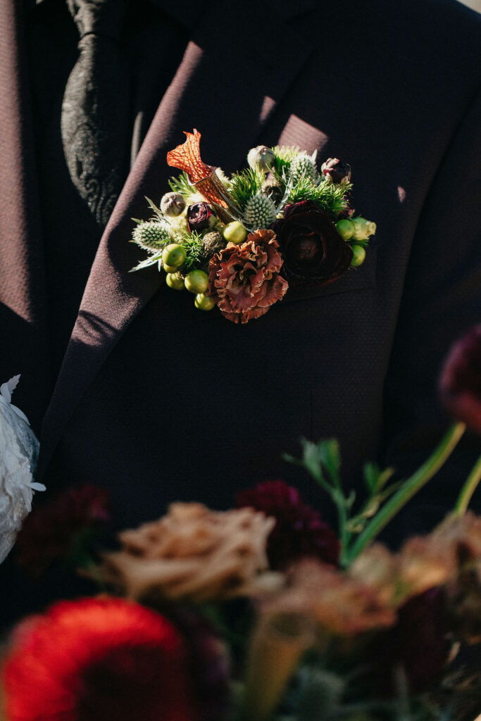 A boutonniere close-up taken at  Spicewood TX treehouse wedding venue 