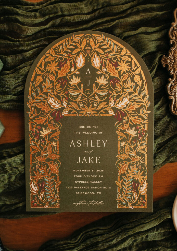 Green wedding invitation taken at a Spicewood TX treehouse wedding venue 