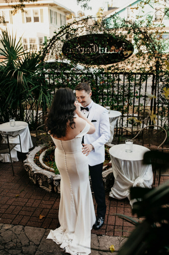 A tearful first look is captured at an Avant Garden wedding in Houston. 