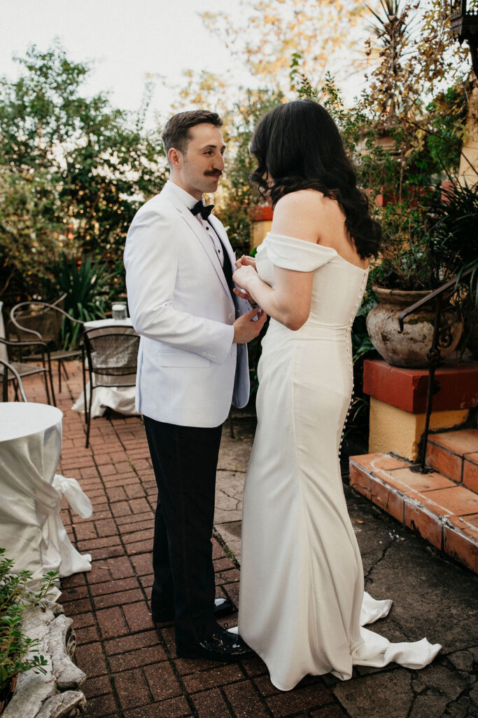 A first look between a bride and groom is captured at an Avant Garden wedding in Houston. 