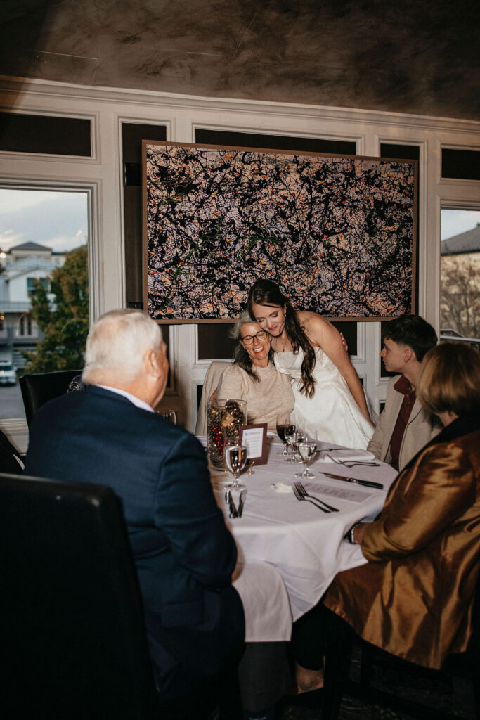 A Texas bride mingles with guests at her winter reception at Brenner's Bayou. 