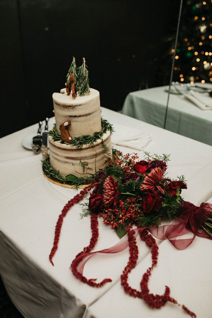 A winter wedding cake & florals are photographed at a Houston elopement reception at Brenner's on the Bayou. 