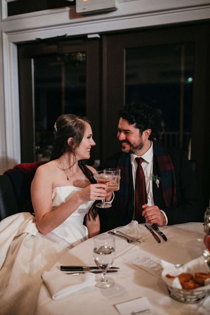 Newlyweds are photographed having a drink at their reception held at Brenner's on the Bayou following their Houston Elopement. 
