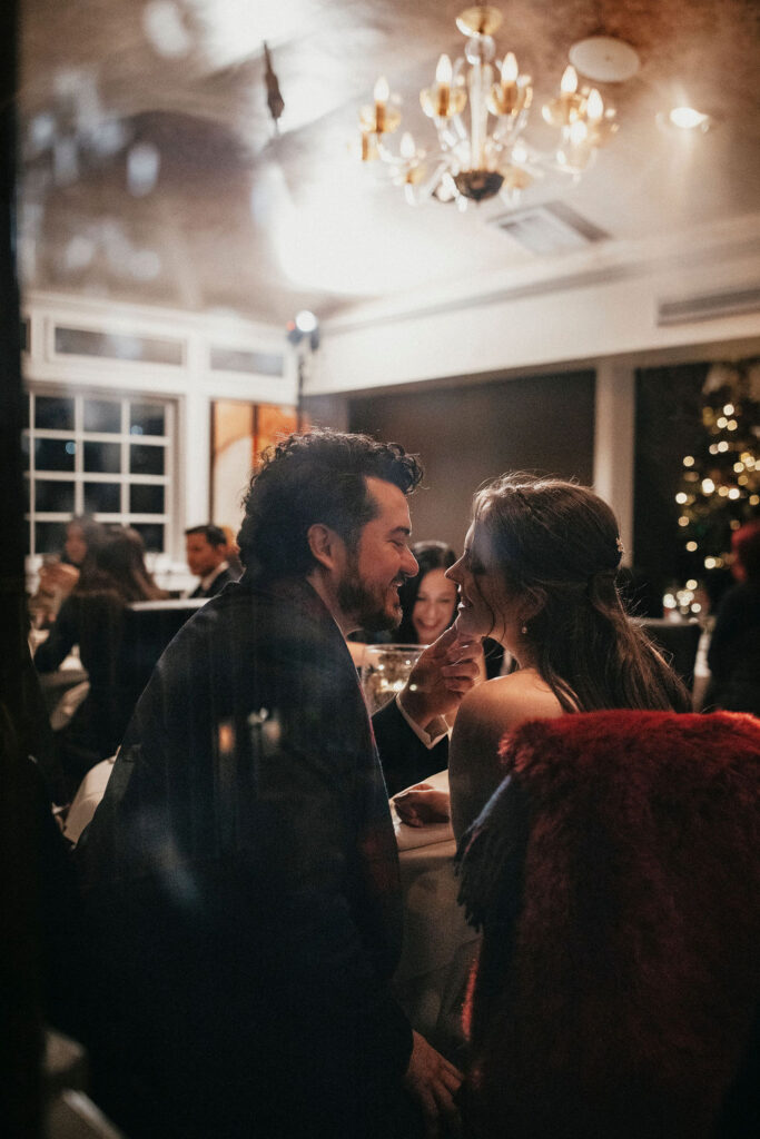 Newlyweds share an intimate moment at their elopement reception at Brenner's Bayou. 