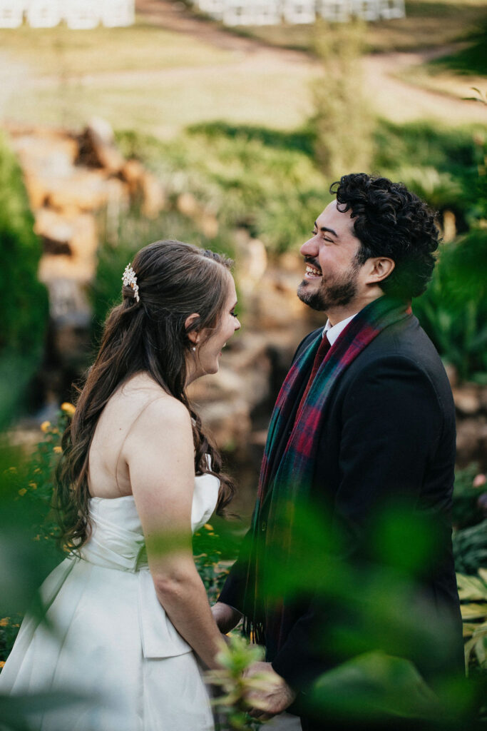 A  candid image of a bride & groom sharing a laugh at their Houston elopement. 