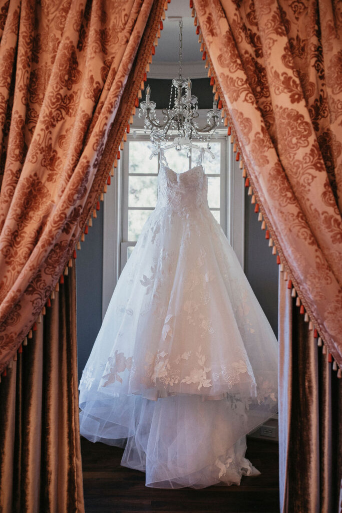 A Sandlewood Manor wedding dress photo taken in the getting ready suite. 