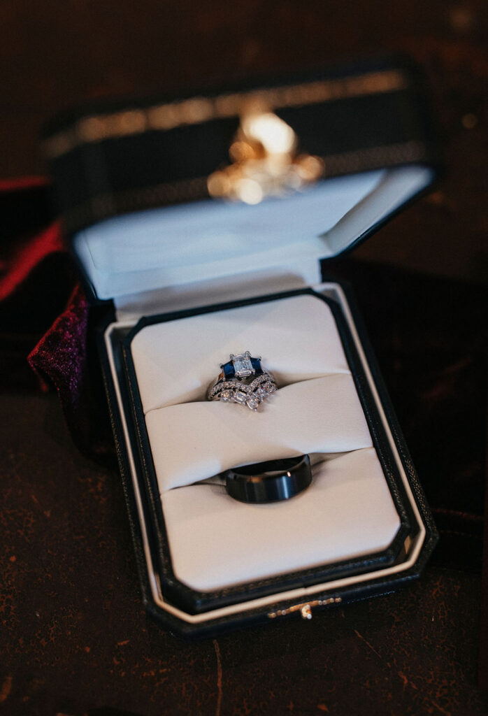 Wedding rings are shown in an image captured at an M3 Ranch wedding by a Houston wedding photographer.